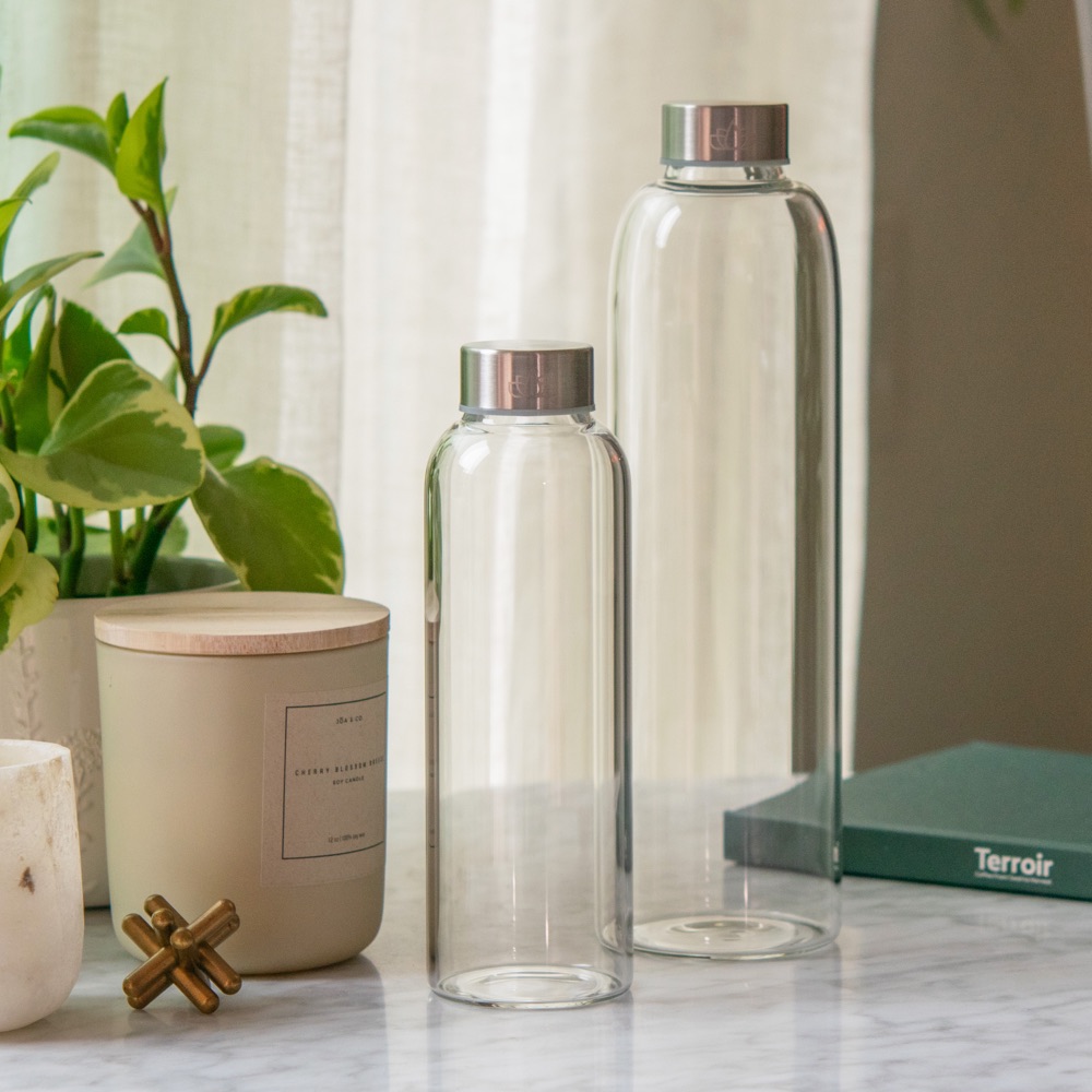 Lotus Water 500 mL and 1000 mL glass mixing bottles on a counter (photo: Lotus Coffee Products)